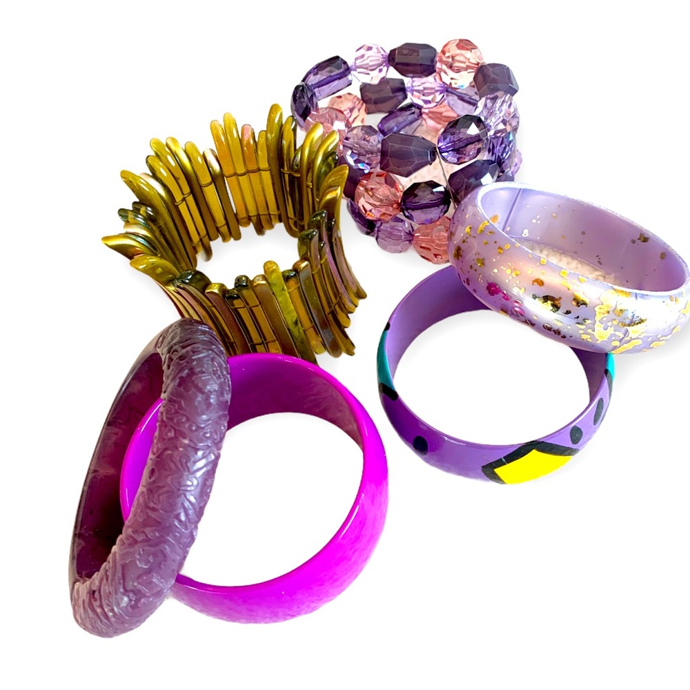 Six unique bracelets in hues of purple and pink